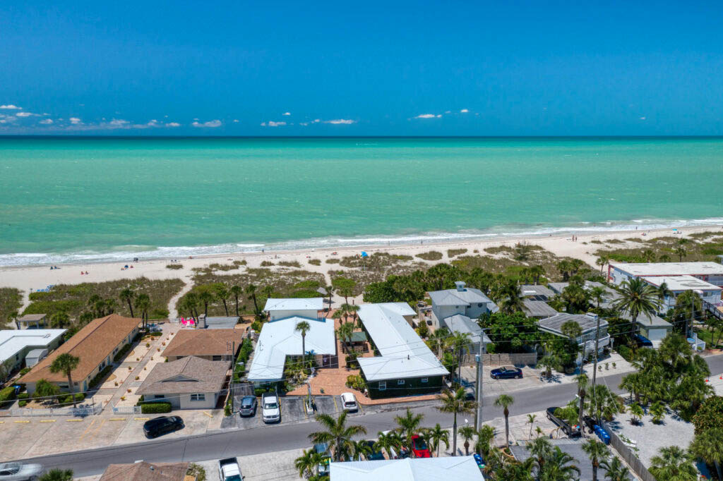 Another drone view of the beach side buildings and rooms facing the gulf at Suntan Terrace